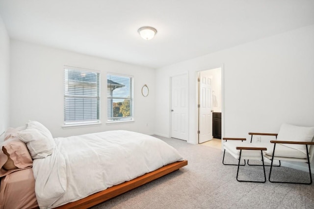 bedroom featuring light carpet