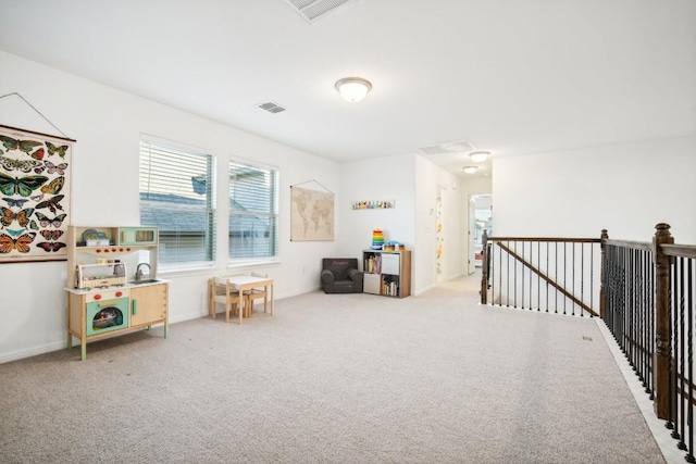 sitting room with light colored carpet