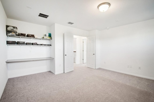 unfurnished bedroom with light carpet