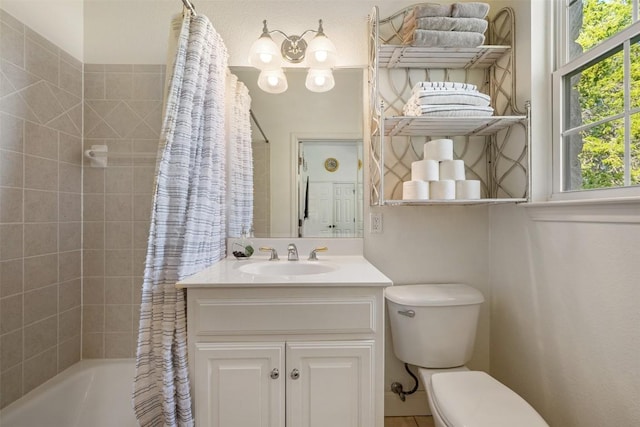 full bathroom featuring shower / bathtub combination with curtain, vanity, and toilet