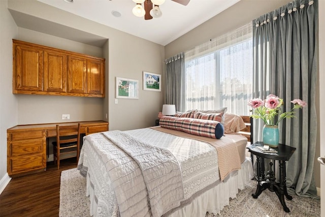 bedroom featuring dark hardwood / wood-style floors and ceiling fan