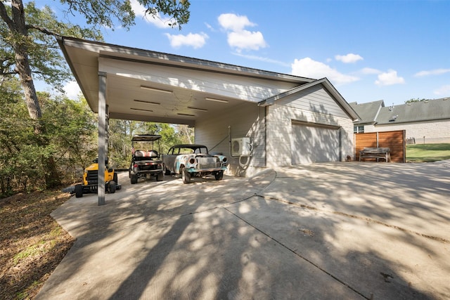 view of property exterior with a garage and ac unit