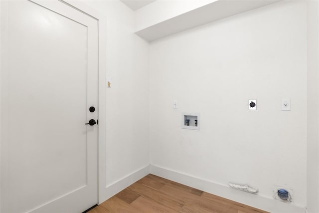 clothes washing area featuring hookup for an electric dryer, light wood-type flooring, and washer hookup