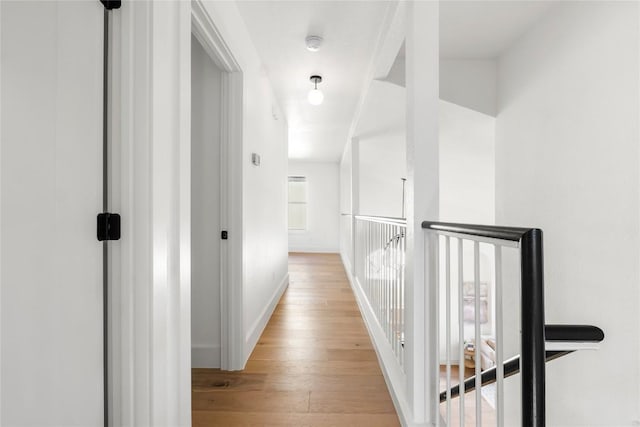 hall with light wood-type flooring