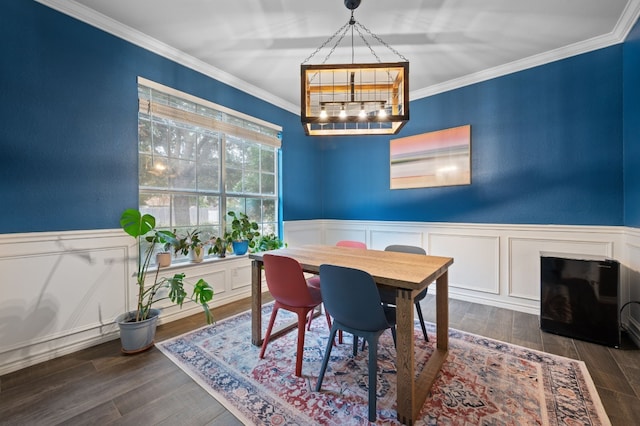 dining area featuring crown molding and dark wood-type flooring