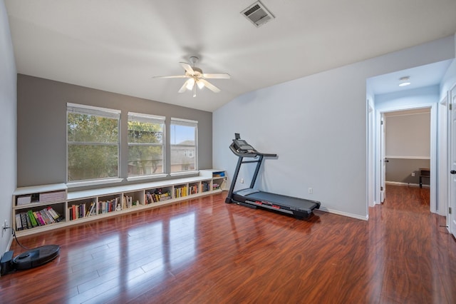 exercise area featuring dark hardwood / wood-style floors, ceiling fan, and lofted ceiling