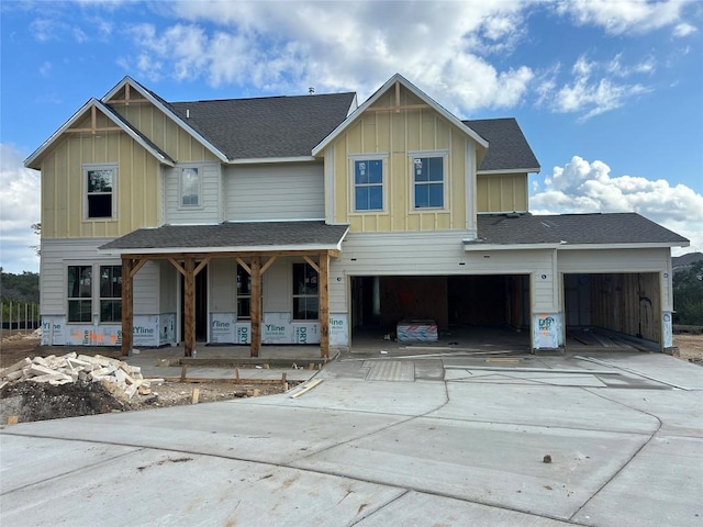 view of front facade with a porch and a garage