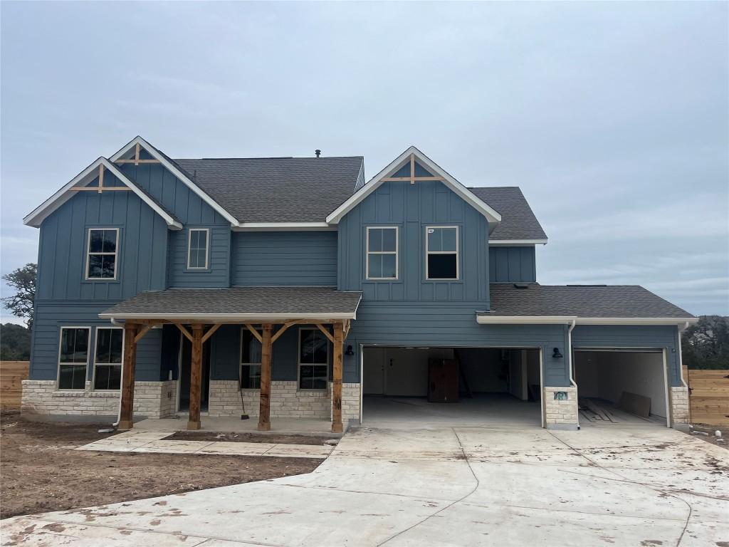 view of front of property with a garage and a porch