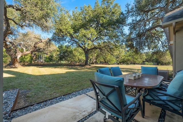 465 Linden Loop, Driftwood, TX 78619 - view of patio / terrace featuring outdoor dining area and view of scattered trees