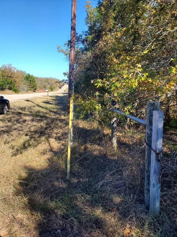 view of yard with a rural view