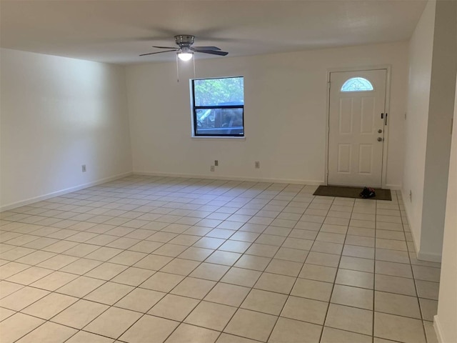 tiled foyer entrance featuring ceiling fan