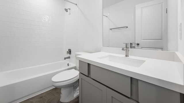 bathroom with toilet, shower / bathtub combination, and vanity