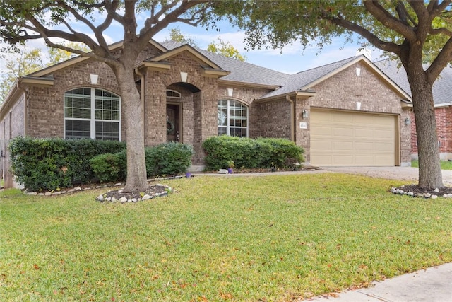 single story home with a garage and a front lawn