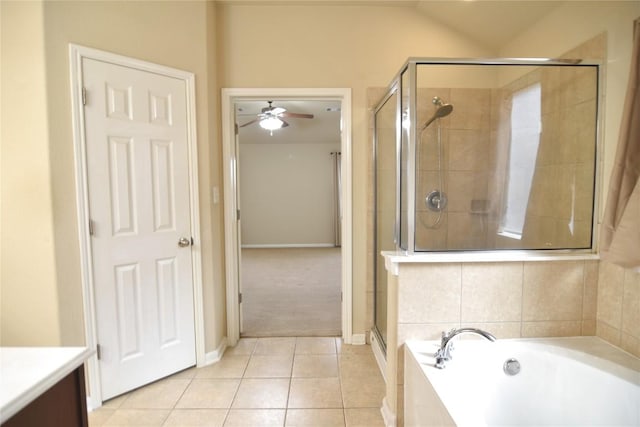 bathroom with vanity, tile patterned floors, vaulted ceiling, ceiling fan, and shower with separate bathtub