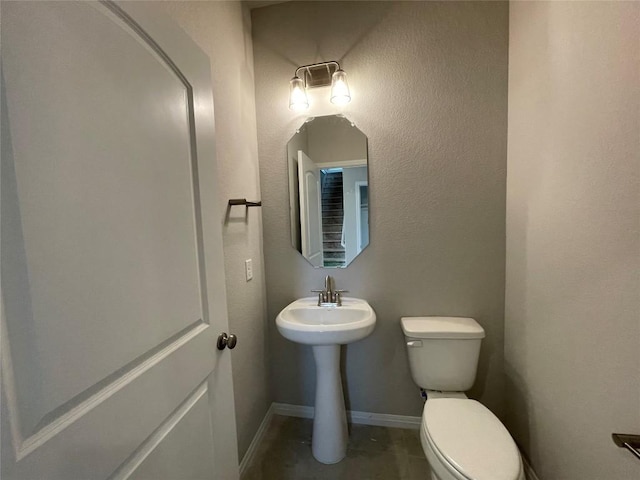 bathroom featuring tile patterned floors and toilet