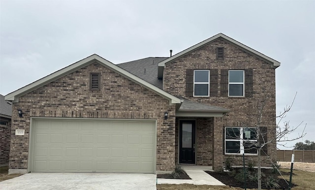 view of front of property with a garage