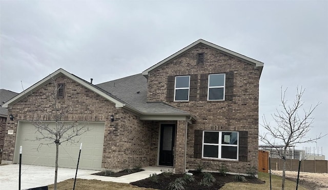 front of property with a garage