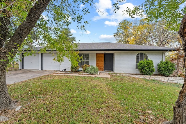 single story home with a front lawn and a garage