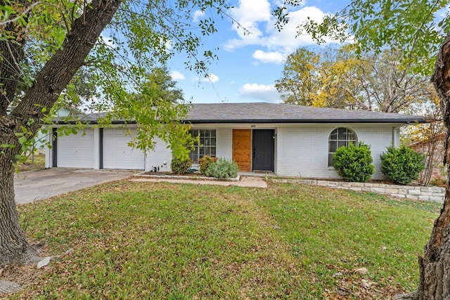 single story home with a garage and a front yard