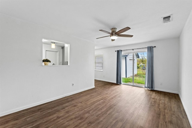 unfurnished room with dark hardwood / wood-style floors and ceiling fan