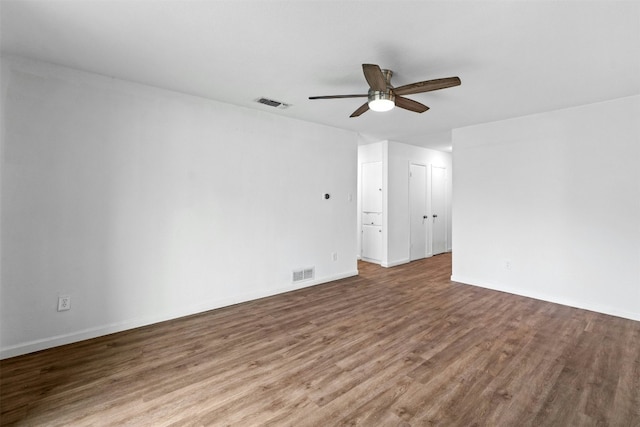 spare room featuring wood-type flooring and ceiling fan