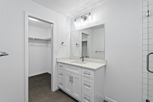 bathroom featuring vanity and tile patterned flooring