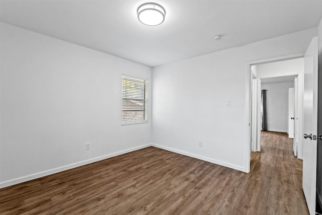 empty room featuring hardwood / wood-style floors