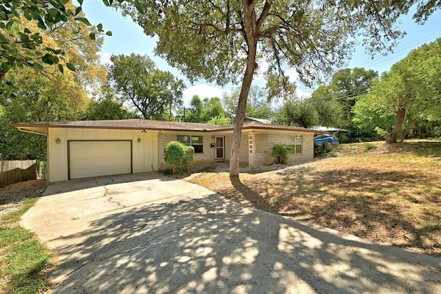 ranch-style home featuring a garage