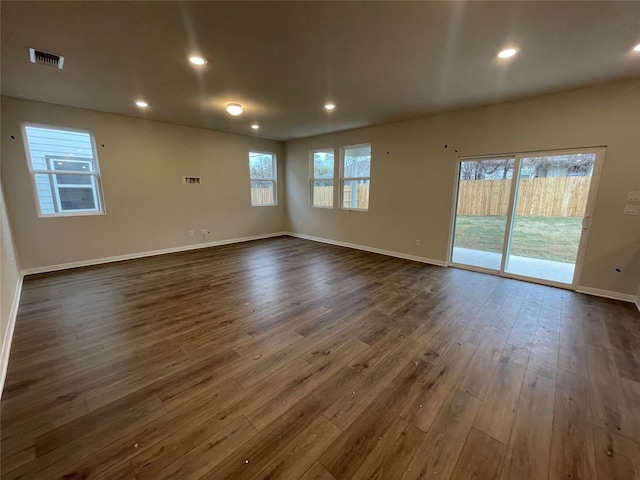 spare room featuring dark wood-type flooring