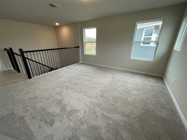 empty room featuring light colored carpet