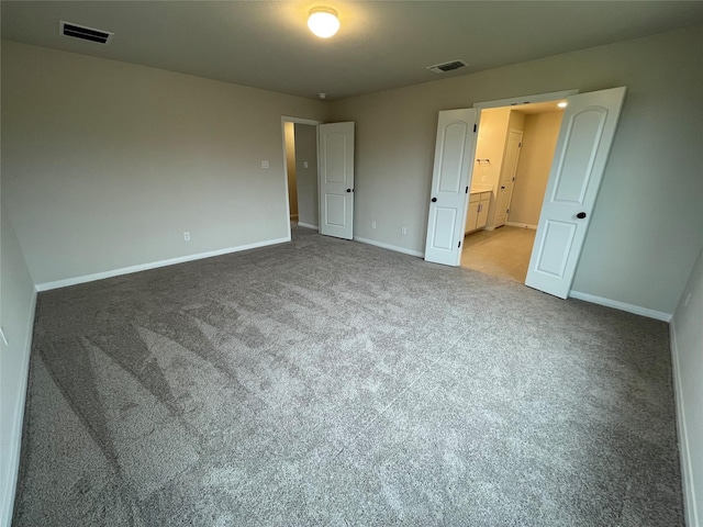 unfurnished bedroom with carpet flooring