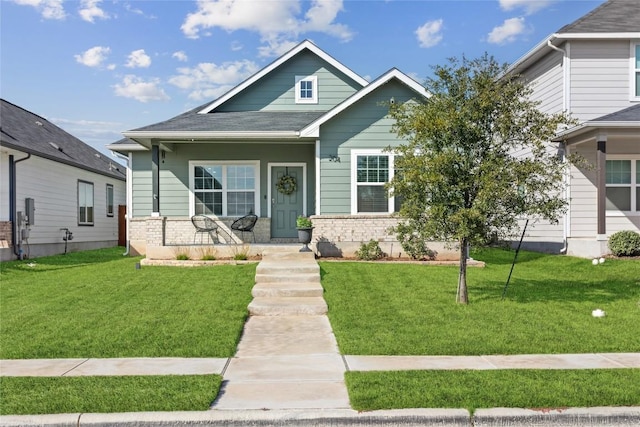 craftsman house with a front yard and covered porch