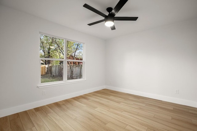 spare room featuring ceiling fan and light hardwood / wood-style flooring