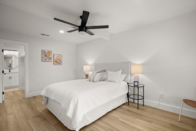 bedroom with connected bathroom, ceiling fan, and light hardwood / wood-style floors