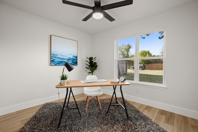 office area with hardwood / wood-style flooring and ceiling fan