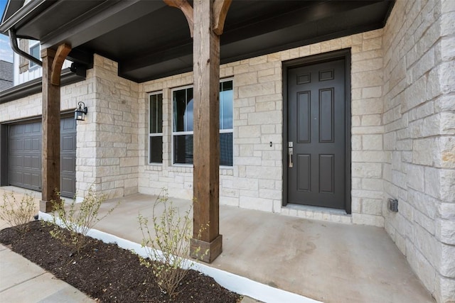 property entrance with a garage