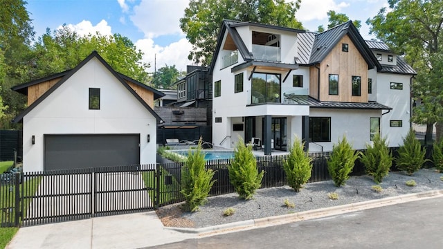 modern farmhouse featuring a garage and covered porch