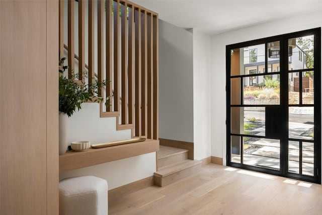 doorway to outside with light hardwood / wood-style floors