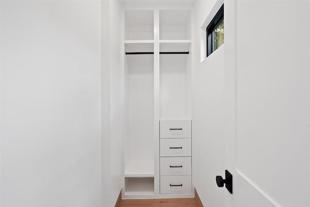 walk in closet featuring hardwood / wood-style flooring