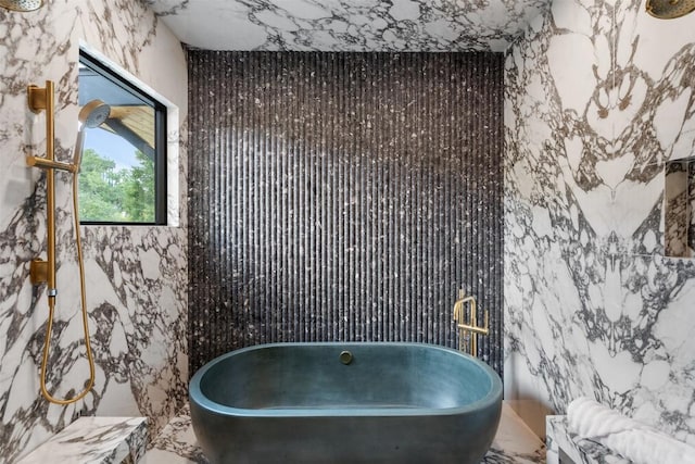 bathroom featuring tile walls and a bathtub