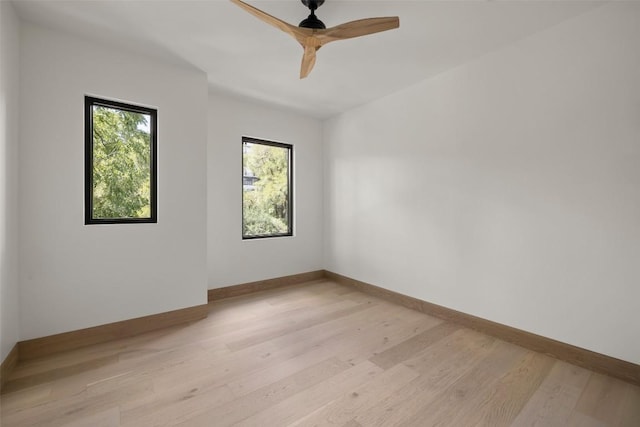 empty room with ceiling fan and light wood-type flooring