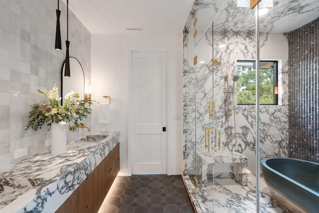 bathroom featuring vanity and separate shower and tub