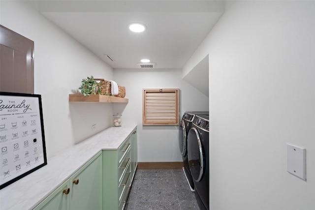 laundry room featuring cabinets and independent washer and dryer