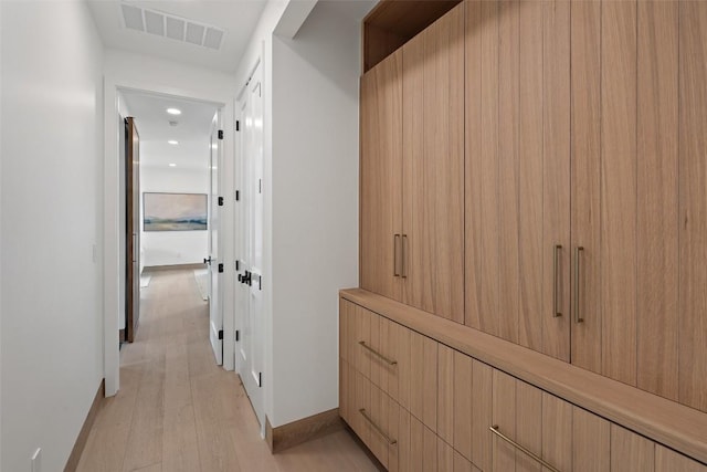 hallway featuring light hardwood / wood-style floors