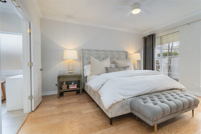 bedroom featuring ceiling fan, crown molding, and light hardwood / wood-style flooring