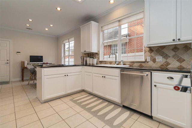 kitchen with dishwasher, backsplash, sink, kitchen peninsula, and white cabinetry