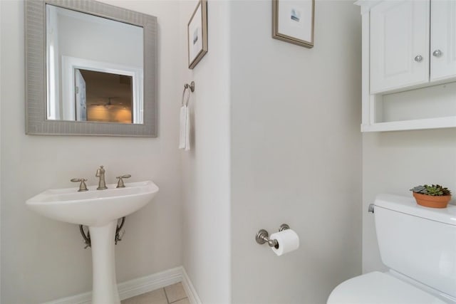 bathroom with tile patterned floors and toilet