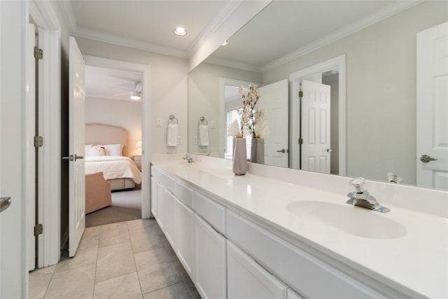 bathroom with tile patterned flooring, vanity, ceiling fan, and ornamental molding