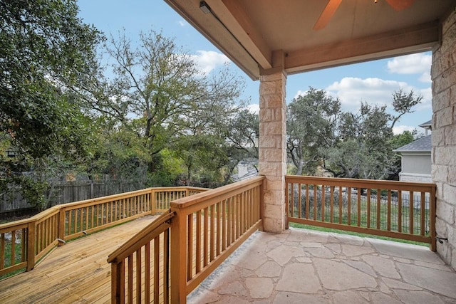 wooden terrace featuring ceiling fan