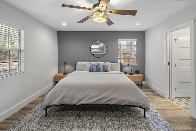 bedroom featuring hardwood / wood-style floors and ceiling fan